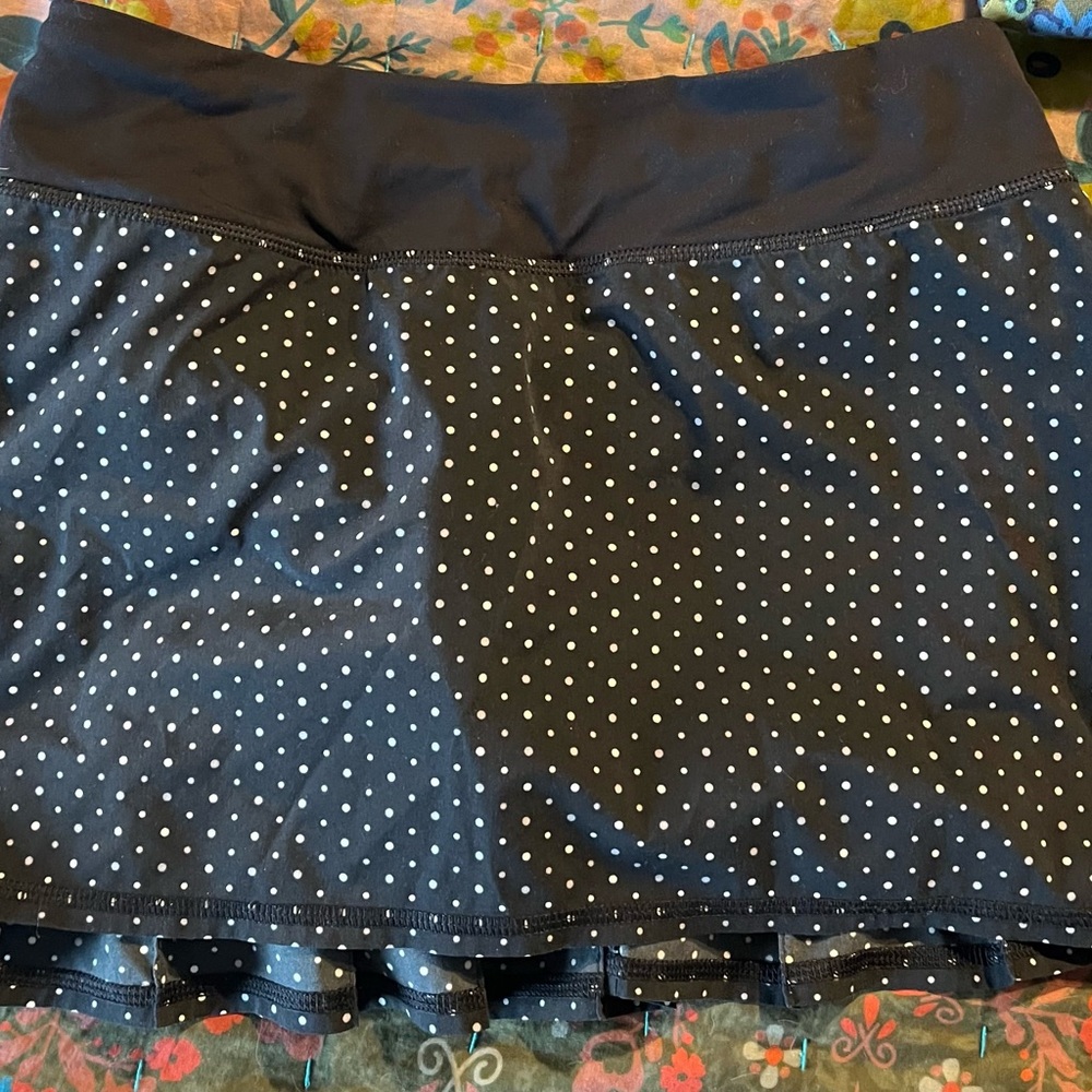 Lulu lemon swim/workout skirt with hidden shorts and small stash pocket.